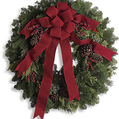 It's not Christmas without a fresh Christmas wreath on your door! Send the spirit of the season to someone special with this classic piece of holiday decor. The 24-inch wreath is composed of fragrant noble fir with touches of juniper and red berries, and is hand delivered by a local florist to ensure maximum freshness.
This 24-inch noble fir wreath is accented with juniper, red berries and pinecones and finished with a full red velvet bow.